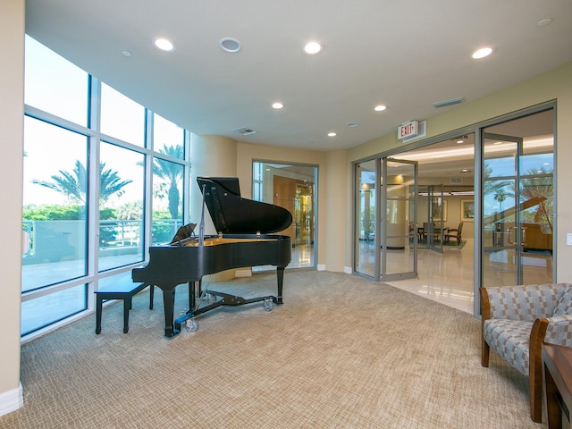 miscellaneous room featuring light colored carpet