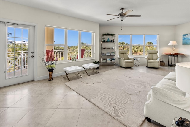 tiled living room featuring ceiling fan