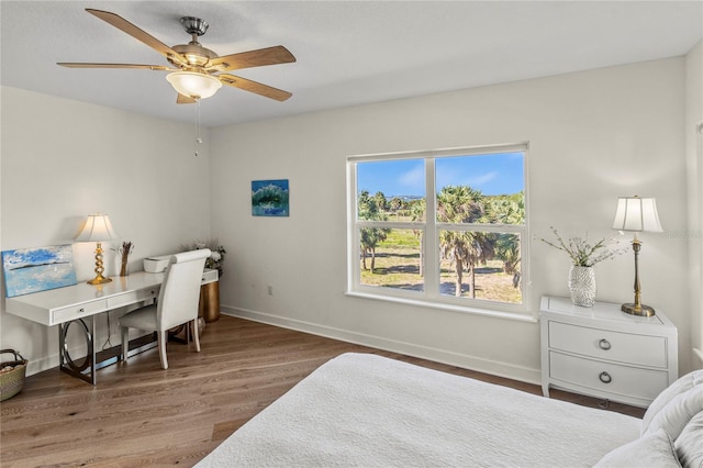 interior space with dark wood-type flooring and ceiling fan