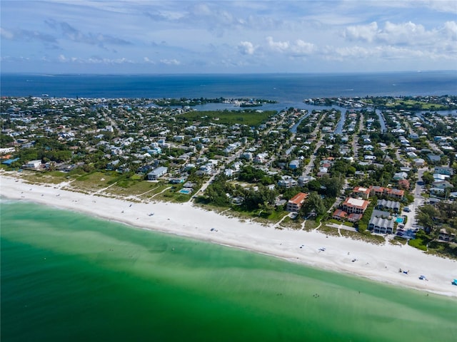 aerial view with a water view and a beach view