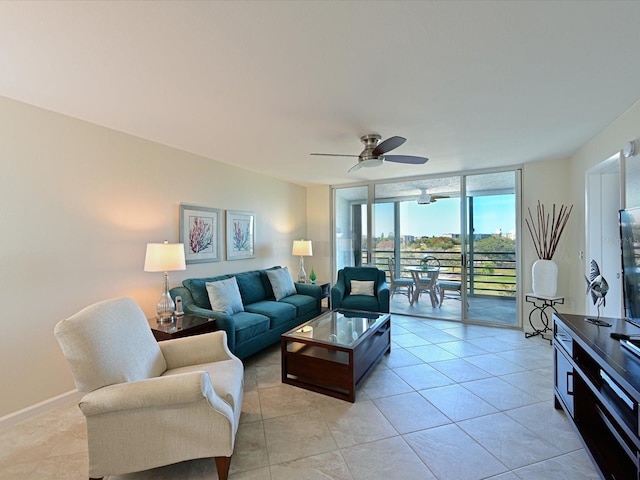 tiled living room with floor to ceiling windows and ceiling fan