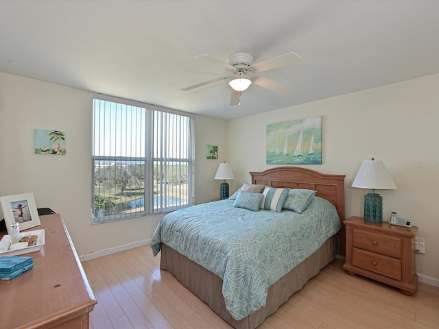 bedroom featuring ceiling fan and light hardwood / wood-style flooring