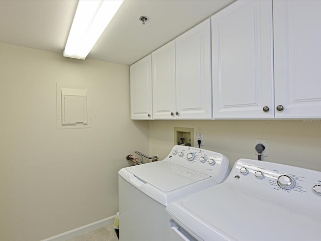 laundry room with hookup for an electric dryer, cabinets, washing machine and dryer, and hookup for a washing machine