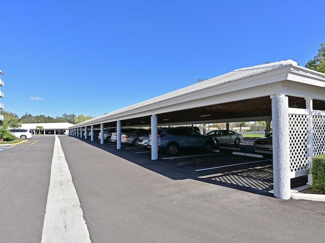 view of parking / parking lot with a carport