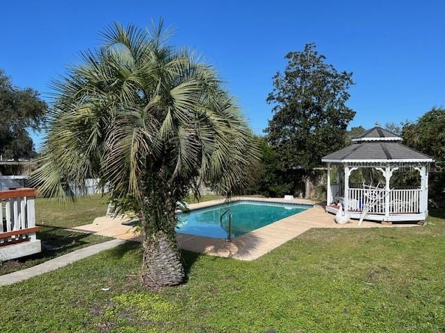 pool featuring a gazebo and a yard