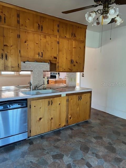 kitchen featuring decorative backsplash, stone finish floor, brown cabinets, and stainless steel dishwasher