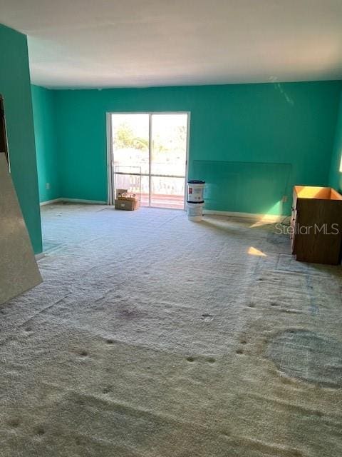 unfurnished living room with carpet flooring