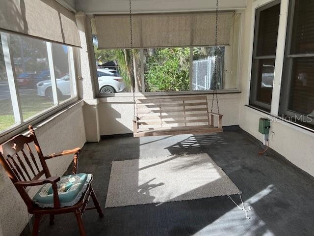 unfurnished sunroom with a wealth of natural light