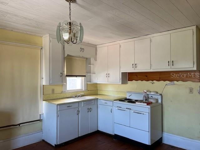 kitchen featuring a sink, open shelves, white cabinetry, light countertops, and white range oven