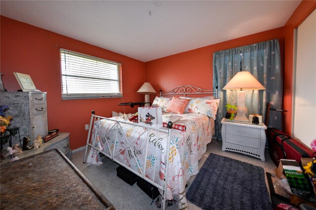 bedroom with light colored carpet