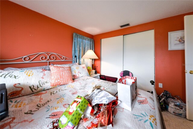 carpeted bedroom featuring a closet