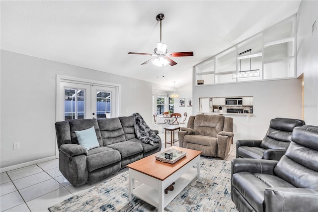 tiled living room with french doors, high vaulted ceiling, and ceiling fan