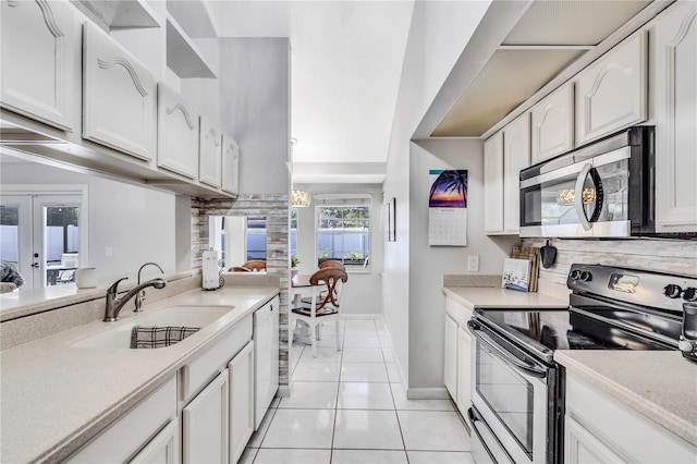 kitchen featuring french doors, sink, white cabinets, black / electric stove, and light tile flooring