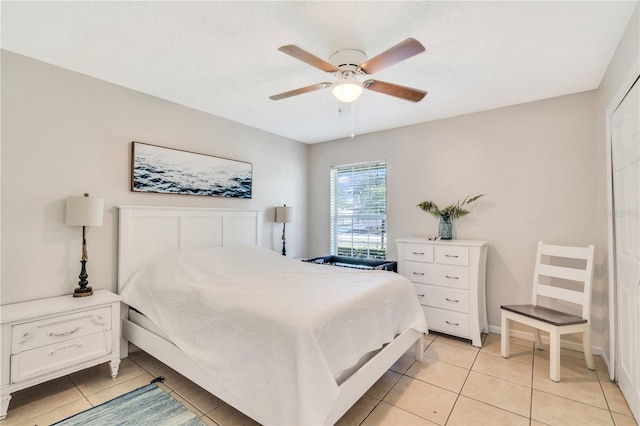 bedroom featuring ceiling fan and light tile flooring