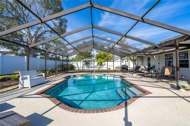 view of pool featuring a patio and a lanai