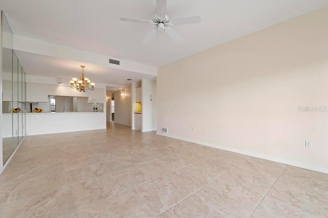 unfurnished living room with ceiling fan with notable chandelier and light tile flooring