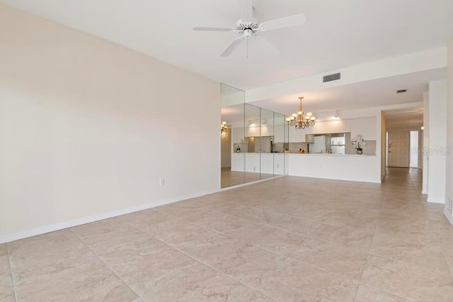 unfurnished living room featuring ceiling fan with notable chandelier and light tile flooring