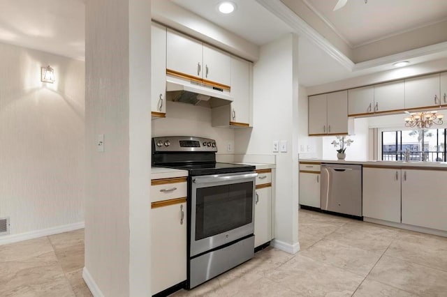 kitchen featuring a chandelier, white cabinets, stainless steel appliances, and light tile floors