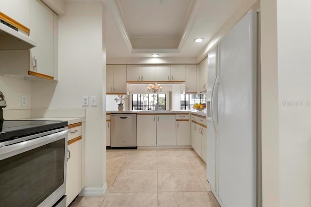 kitchen featuring stainless steel appliances, light tile floors, custom range hood, a chandelier, and a raised ceiling