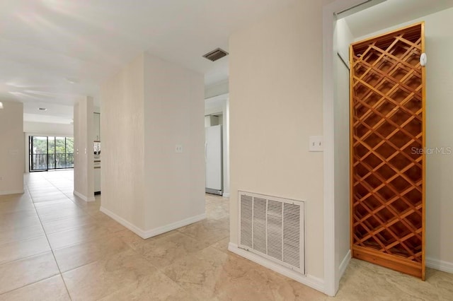 wine cellar with light tile floors