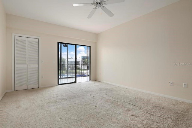 unfurnished room with light carpet and ceiling fan