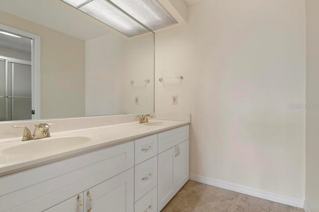 bathroom featuring dual vanity and tile flooring