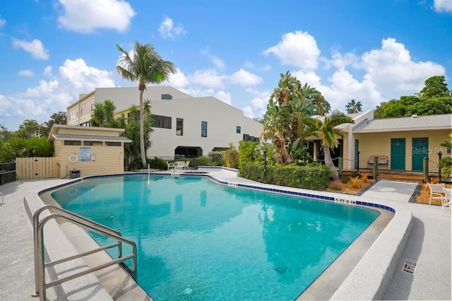 view of swimming pool featuring a patio area