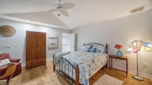 bedroom featuring vaulted ceiling, ceiling fan, and light wood-type flooring