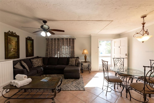 living room featuring a textured ceiling, ceiling fan, and ornamental molding