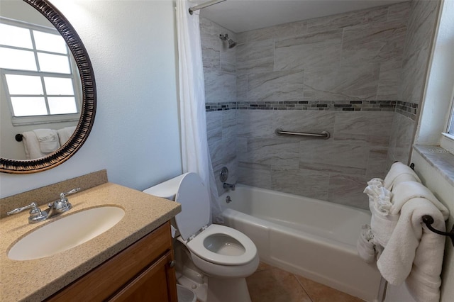 full bathroom with toilet, tile floors, tiled shower / bath combo, and vanity