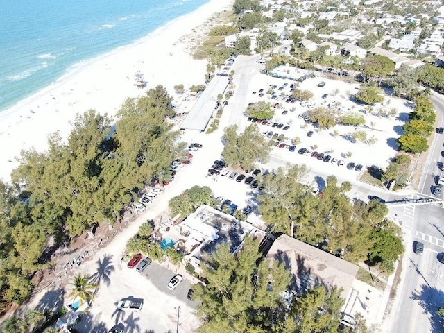 aerial view with a water view and a view of the beach