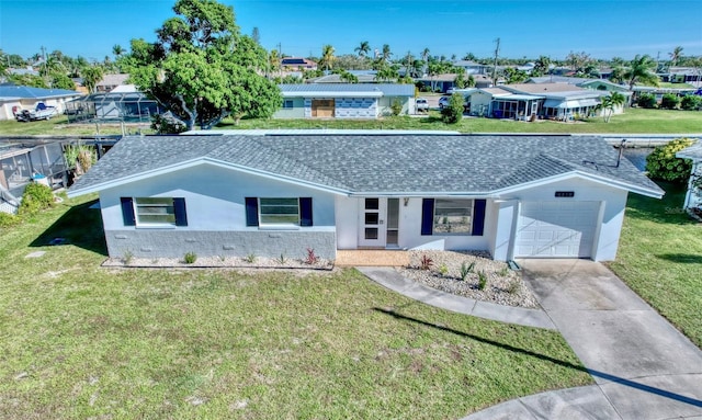 view of front of home with a front lawn and a garage