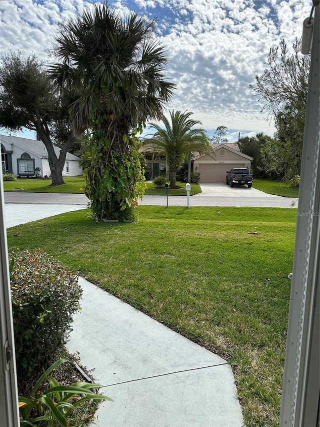 view of yard featuring a garage