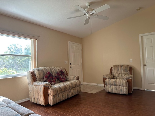 tiled living room with ceiling fan