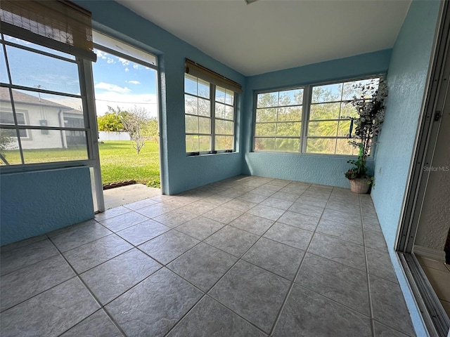 unfurnished sunroom with a wealth of natural light