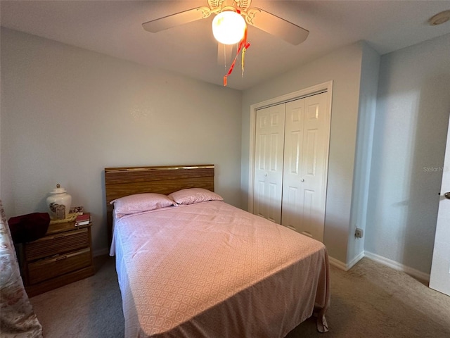 carpeted bedroom with a closet and ceiling fan