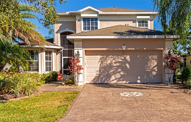 view of front of property with a garage