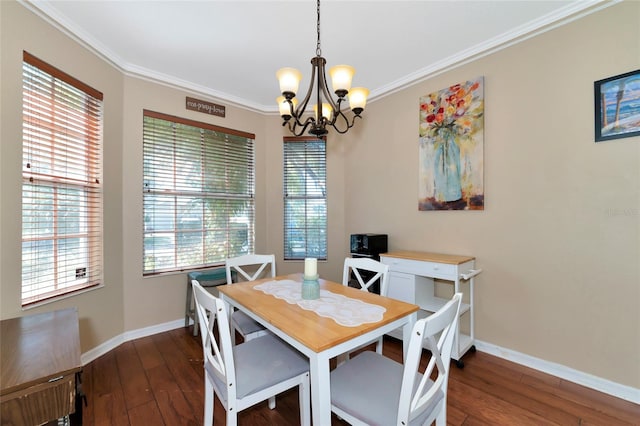 dining area featuring crown molding, an inviting chandelier, and dark wood-type flooring