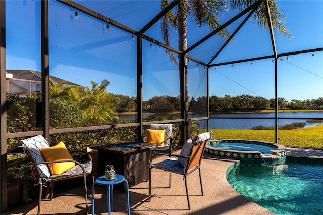 view of swimming pool with an in ground hot tub, a patio, and a lanai