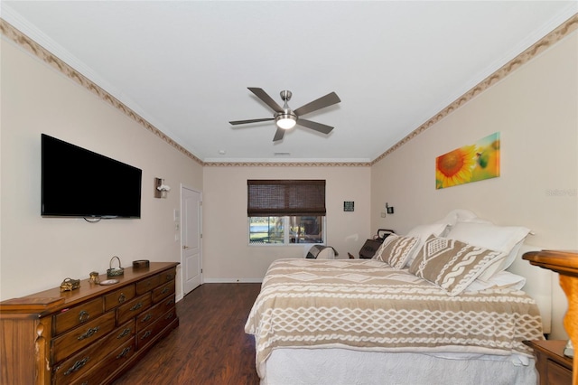 bedroom featuring crown molding, ceiling fan, and dark wood-type flooring