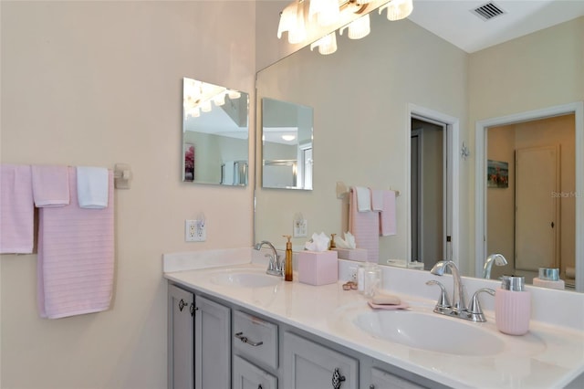 bathroom featuring dual vanity