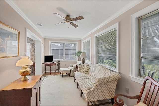 sunroom / solarium featuring ceiling fan