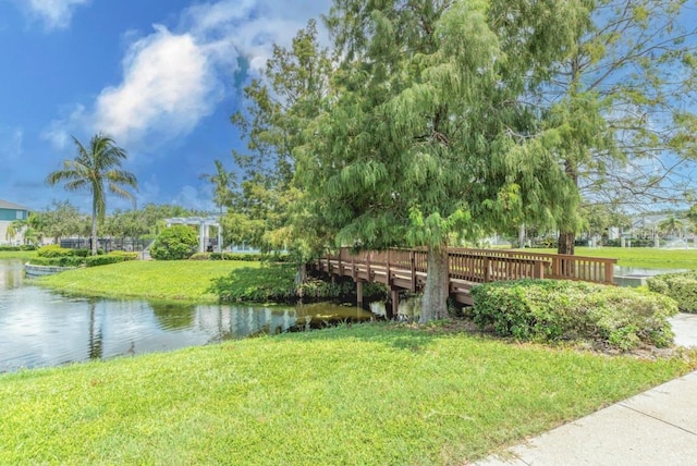 exterior space with a yard and a water view