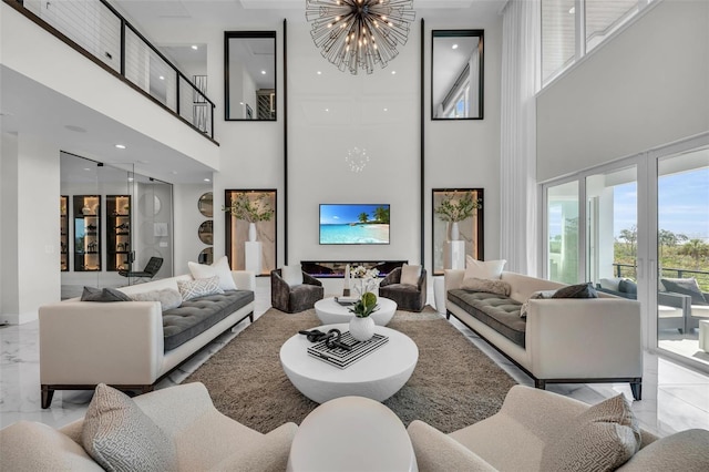 tiled living room with a notable chandelier and a towering ceiling