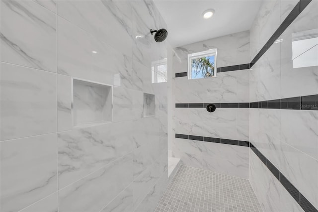 bathroom with tiled shower