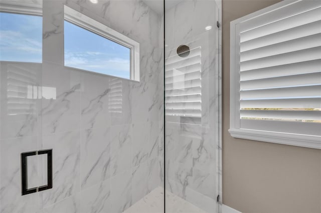 bathroom featuring tiled shower