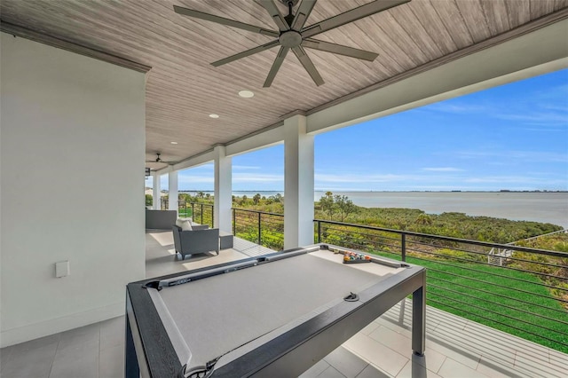 game room featuring a water view, billiards, and wood ceiling