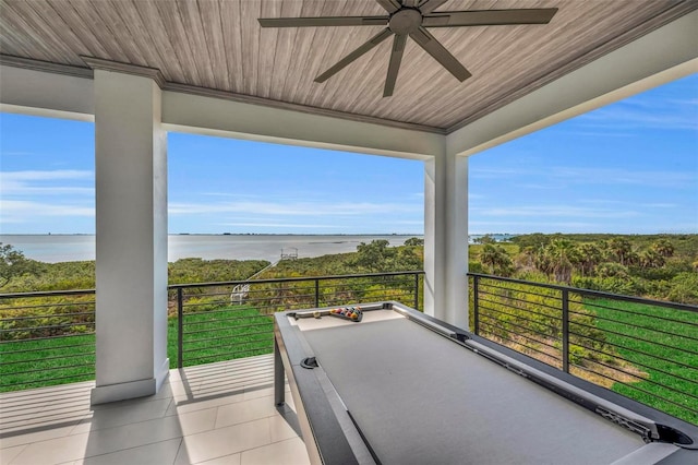 view of patio / terrace with a balcony, a water view, and ceiling fan