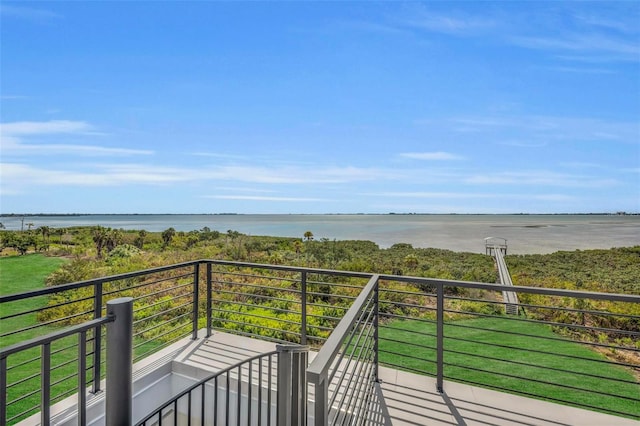 wooden deck with a water view