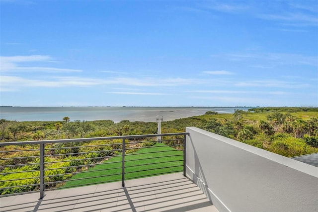 balcony featuring a water view